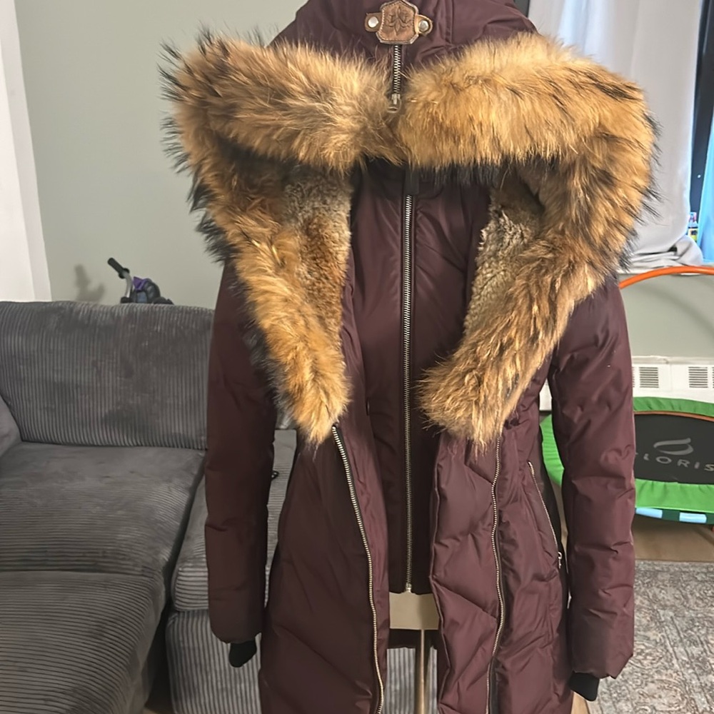 Burgundy Mackage coat with fur trim. Good condition, zippers work, some spots